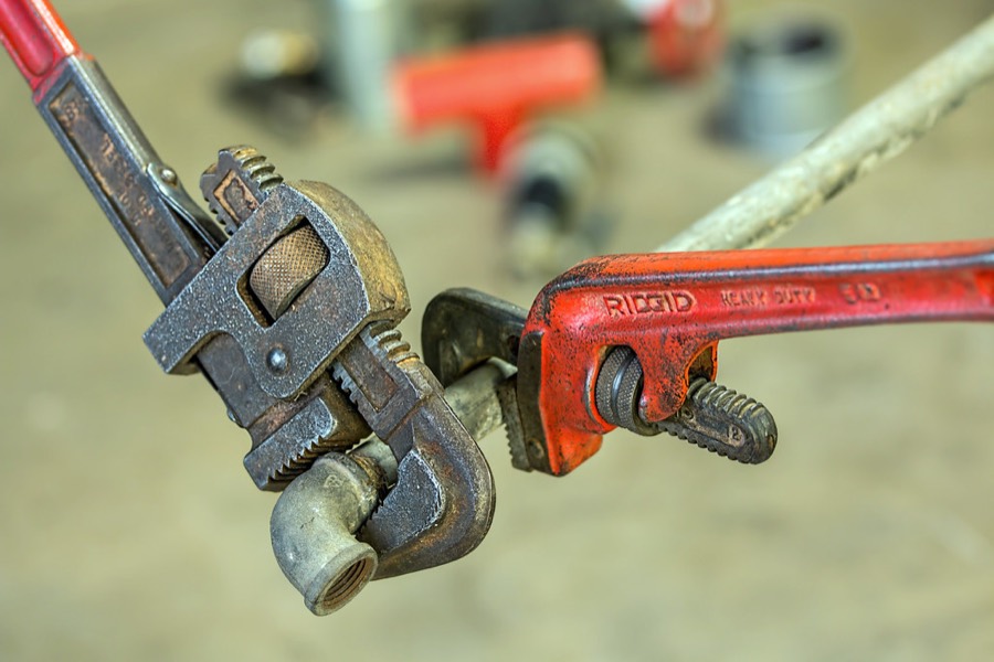 Pipe wrenches on a plumbing line